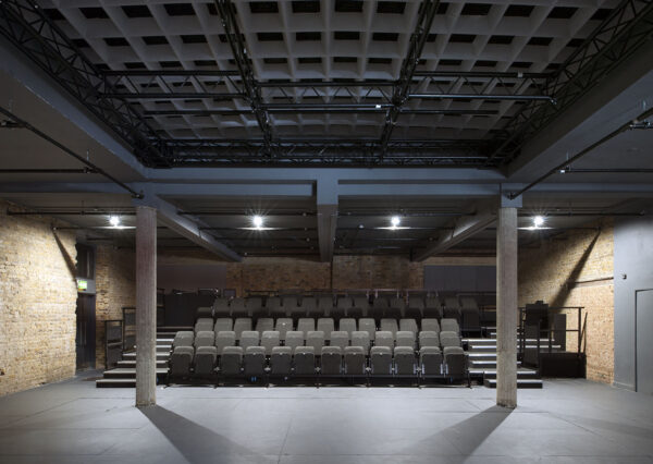Holloway Theatre. A seating bank with pillars on either side.